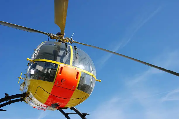 Photo of yellow and orange rescue helicopter