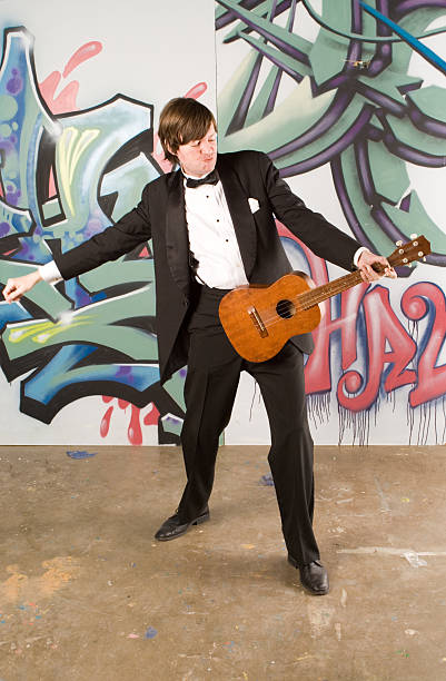 istock Jammin on the Ukulele Man in Tux Windmilling 144220888