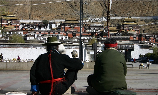 Two Old Tibetans, chatting in front of Tashilunpo Temple, Shigaze, Tibet