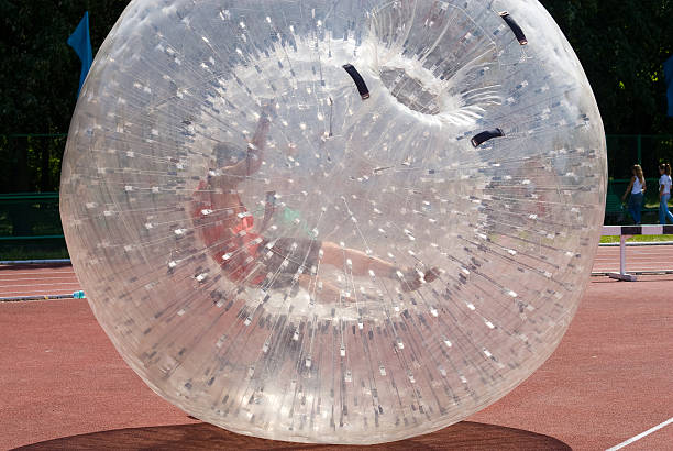 zorb ball zorb ball rolling on the ground zorbing stock pictures, royalty-free photos & images