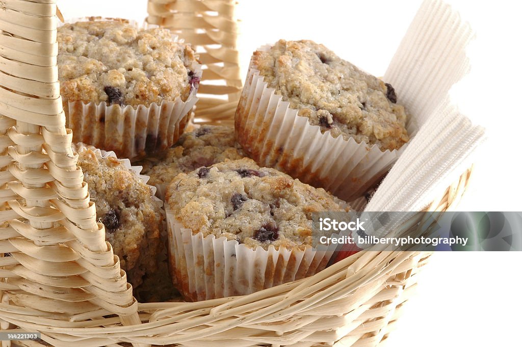 Fresh Muffins Close-up of fresh baked muffins in a basket. Basket Stock Photo