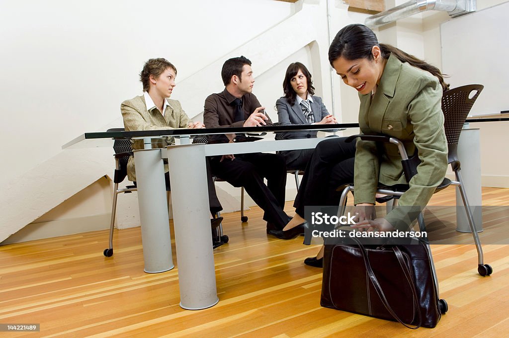 The Interview Woman pulling papers out at meeting. Adult Stock Photo