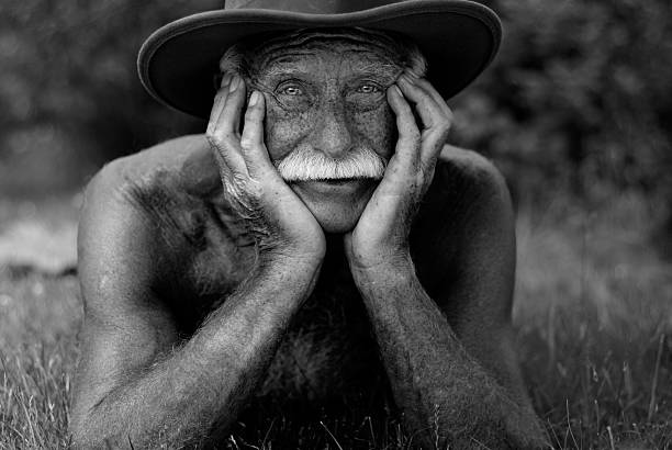 Senior man with his head in hands