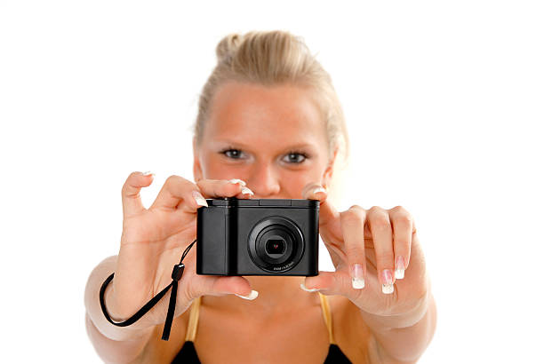 istock Girl with a digital camera 144221797