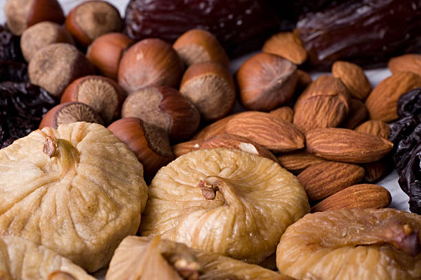 Figs, hazelnuts, almonds, prunes stock photo