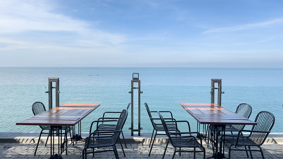 Empty table and chair for dining set nearly sea ocean