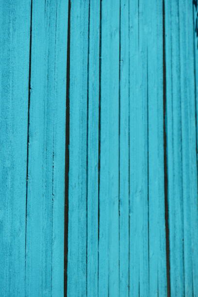 Brightly colored turquoise wood privacy fence