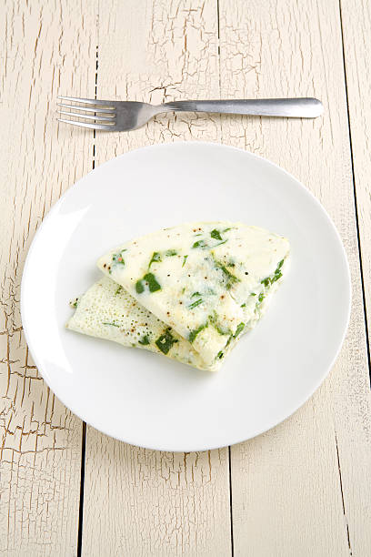 Egg white and spinach omelet Egg white and spinach omelet on a white plate albumen stock pictures, royalty-free photos & images