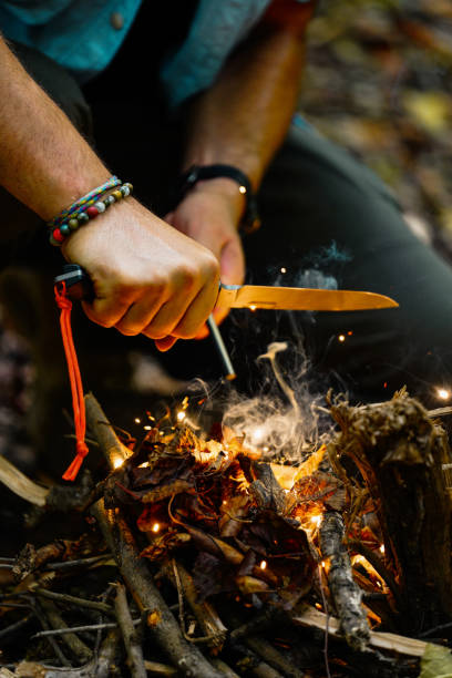 istock Bushcraft fire starting with fire steel and striker 1442219840
