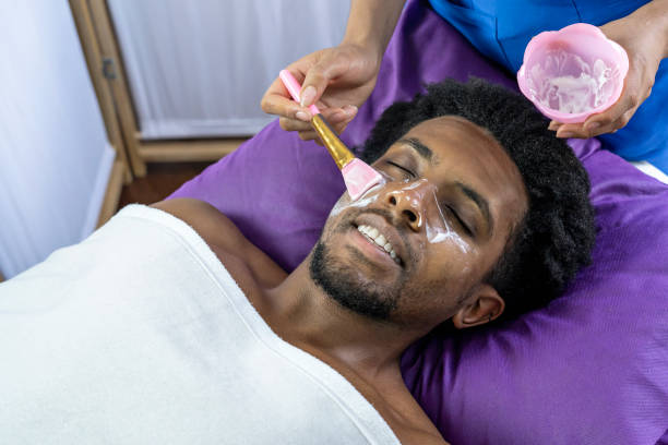 istock Applying white facial mask. 1442228833