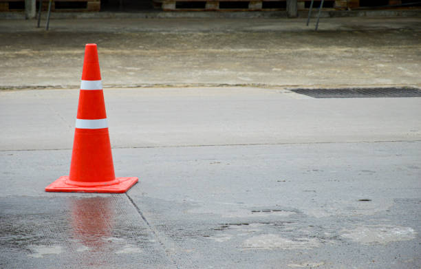 istock orange traffic cone set on the road 1442232781