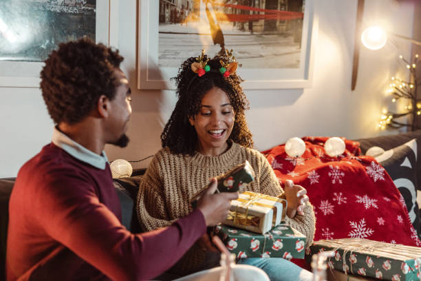 istock Christmas gift exchange at home 1442233305