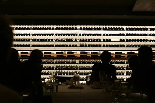 Fancy wine and dine silhouettes at a wine bar.
