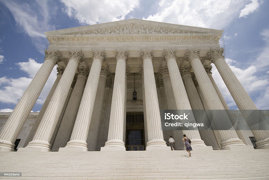 Facade of Supreme Court Building Washington DC Blue Sky Facade of Supreme Court.   - See lightbox for more US Supreme Court Building Stock Photo