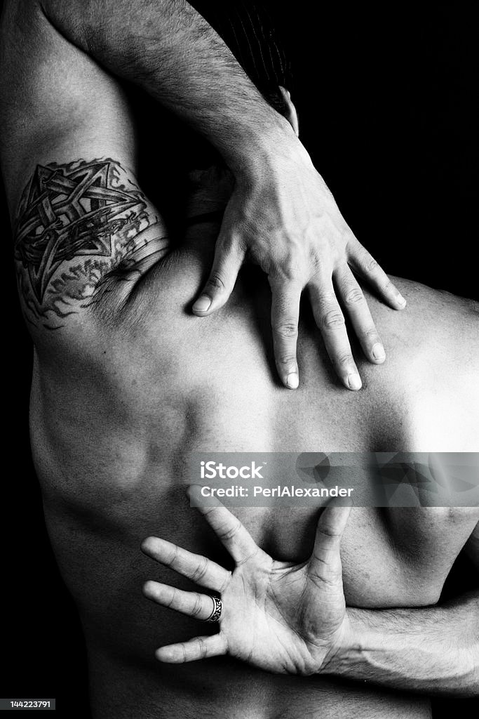 Back Picture of a man's back, black and white with high contrast. Adult Stock Photo