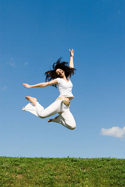 istock happy young woman is jumping 144223795