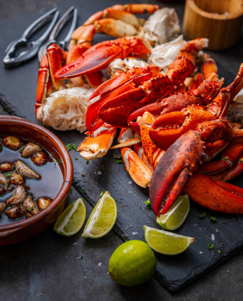 istock Fresh lobster claws and Dungeness crab legs ready to eat 1442238806