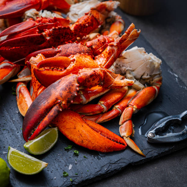 istock Lobster claws and Dungeness crab legs ready to eat 1442238840