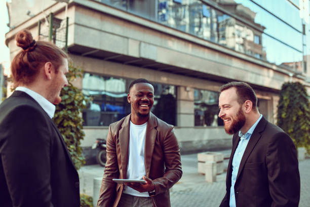 istock Smiling Businessmen Of Different Ethnicities Using Meeting Break To Share A Few Laughs 1442238940