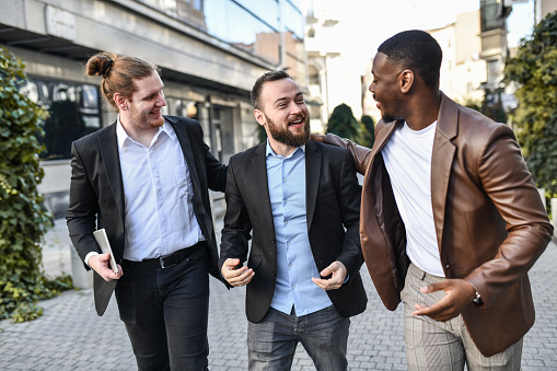 Multiethnic Businessmen Discussing Private Interests After Finishing Work Aspect Of Relationship