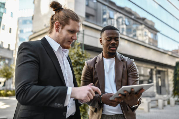 istock Multiethnic Businessmen Checking New Banking App On Digital Tablet 1442239919