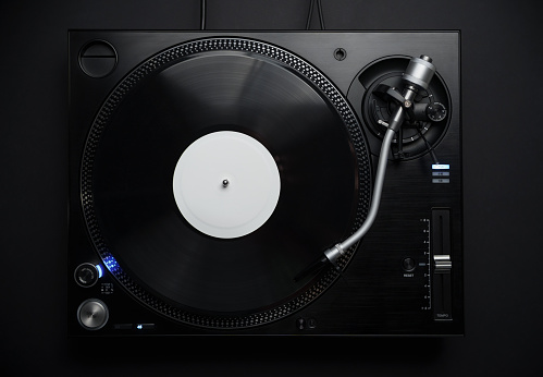 Dj turntable in flat lay. Professional hi fi turn table player for disc jockey shot directly from above