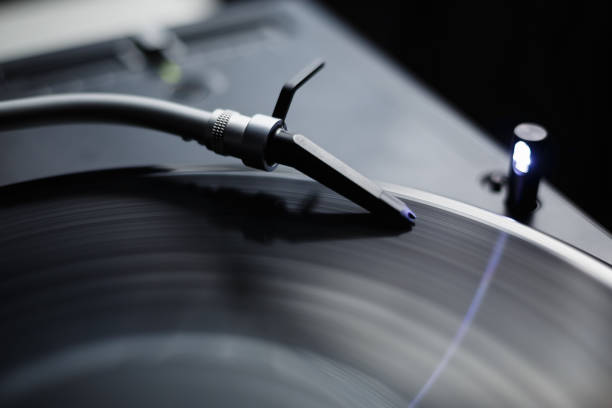 istock Turntables needle on vinyl record. Professional dj turn table player device in closeup 1442240697