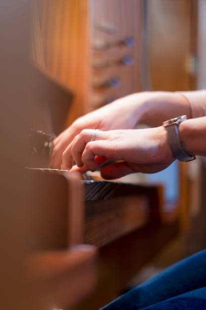 istock Pianist on the organ rehearsing her performance 1442241901