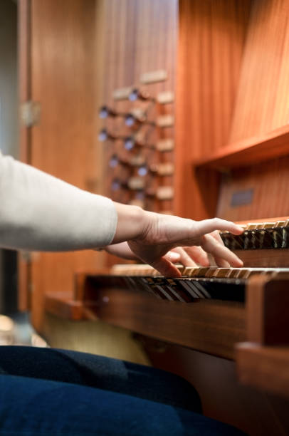 Pianist on the organ rehearsing her performance