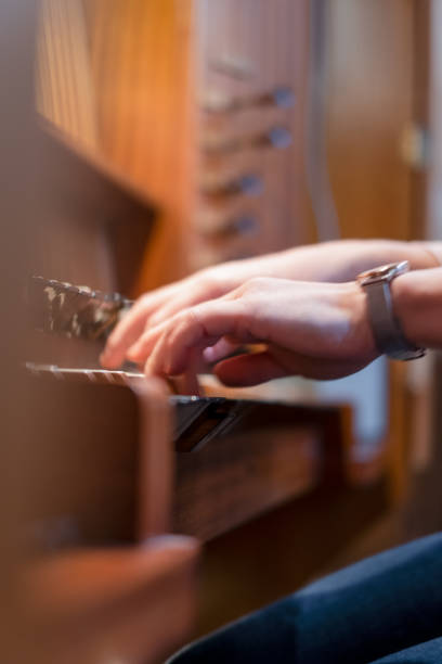 istock Pianist on the organ rehearsing her performance 1442242294
