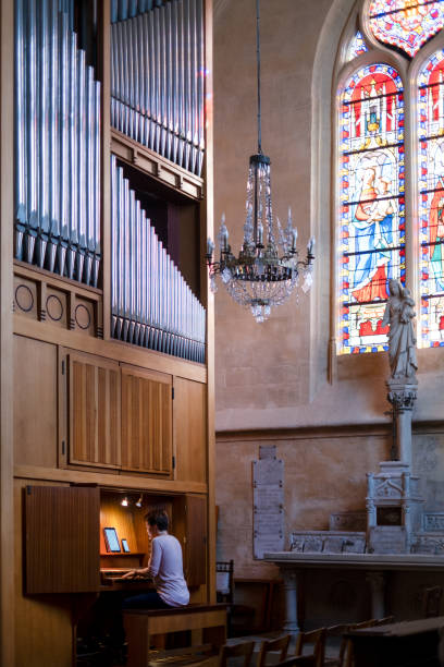 istock Pianist on the organ rehearsing her performance 1442242628