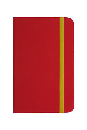 red notebook with yellow elastic band isolated on white background