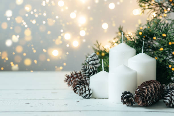 istock Advent white candles with decor in shiny lights 1442249560