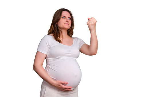 Portrait of a pregnant woman with a threatening fist gesture on a white background