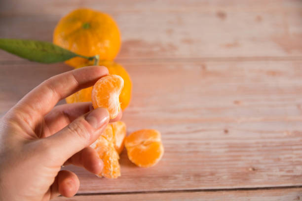 istock Tangerines fruit isolated on dark and wood background. Copy space. 1442253784