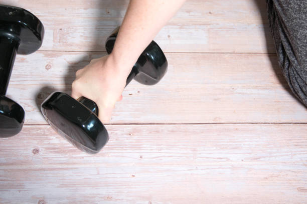 istock Pack of dumbbells on wood 1442255055