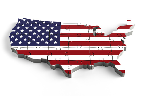 American national flag, the Stars and Stripes, printed on a jigsaw puzzle with lots of texture, representing a government or political problem to be solved.