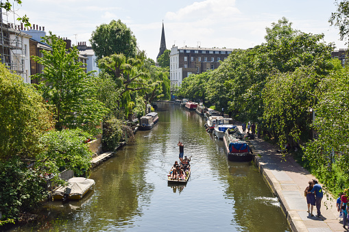 London, United Kingdom - June 3 2021: People enjoy a warm day on Regent's Canal in Primrose Hill, Camden