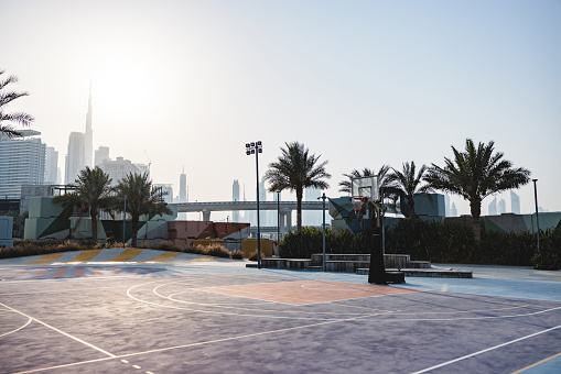 Basketball Court Outdoors And A View Of Tall Building In Te Back In Dubai.