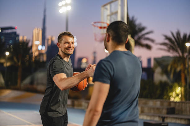 Team Mates Happily Shaking Hands Before The Game In Dubai