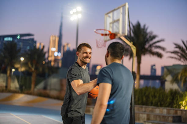 istock Multi Ethnic Friends  Shaking Hand Before Playing Basketball In Dubai 1442258648