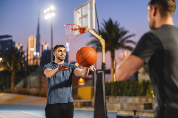 istock Multi Ethnic Friends Playing Basketball In Dubai 1442258669