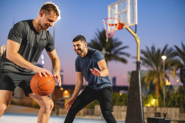 istock Multi Ethnic Friends Playing Basketball In Dubai 1442258682