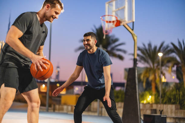 istock Multi Ethnic Athletes Having Fun And Playing Basketball In Dubai 1442258704