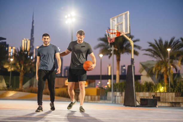 istock Multi Ethnic Friends Playing Basketball In Dubai 1442258736