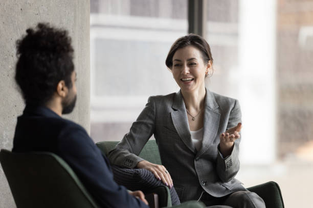 istock Multiracial office employees talking and laughing during break in workspace 1442259702