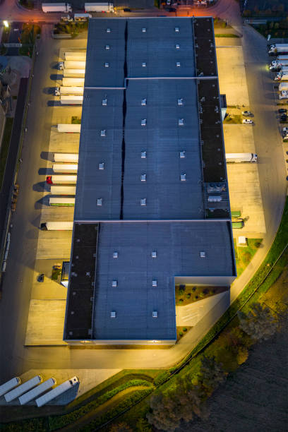 istock Distribution warehouse at dusk - aerial view 1442259703