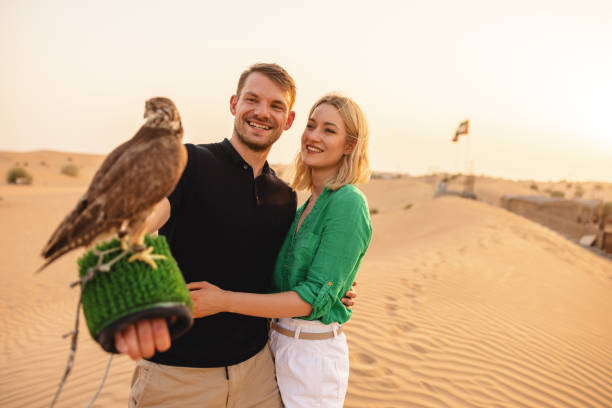 istock Two Caucasian Tourist Try Falconry In Dubai 1442260717