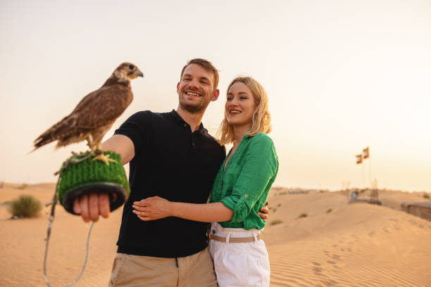 istock Happy Tourists Experiencing Falconry In Dubai 1442260719