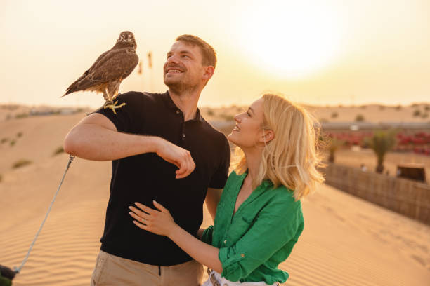 istock Young Man With A Falcon On His Shoulder In Dubai 1442260741